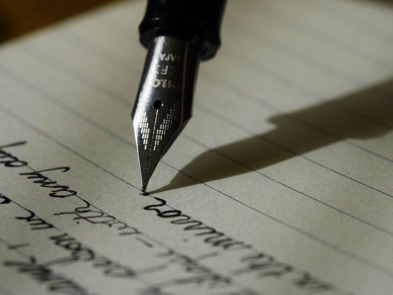 A fountain pen writing on paper
